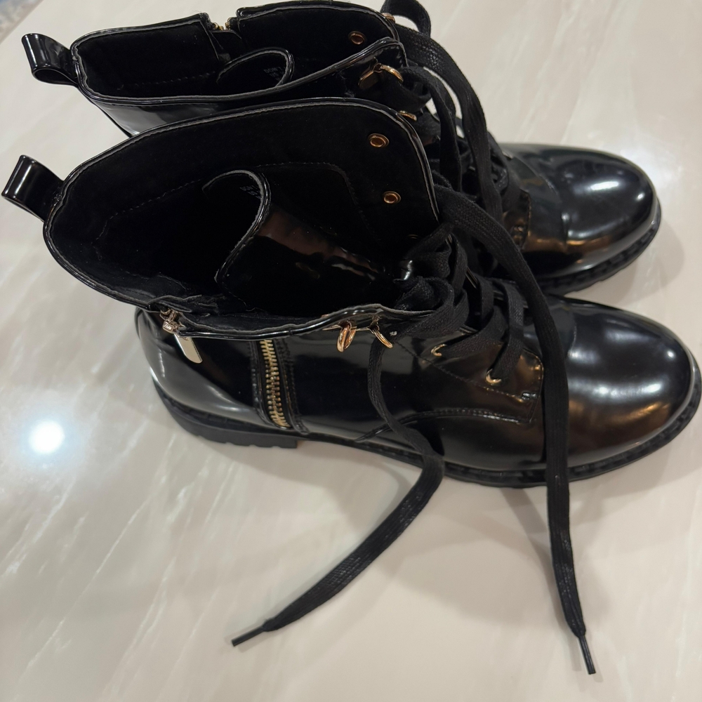 Glossy Black Combat Boots with Gold Accents